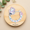 chupetero-personalizado-tambor-olivia-rosa-lila-fondo-bonito