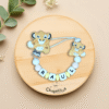 chupetero-simba-personalizado-raul-beige-azul-fondo-bonito