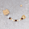 sujetachupetes-leon-oso-madera-silicona-bebe-neutro