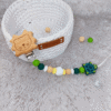 cadena-chupete-leon-tortuga-colores-verdes-bebe