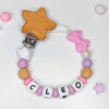chupetero-personalizado-lazo-estrella-cleo-rosa-lila-madera