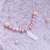 collar-denticion-silicona-pluma-colores-pastel-rosa-lavanda