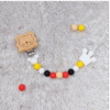 sujetachupetes-leon-corona-madera-silicona-colores-blanco